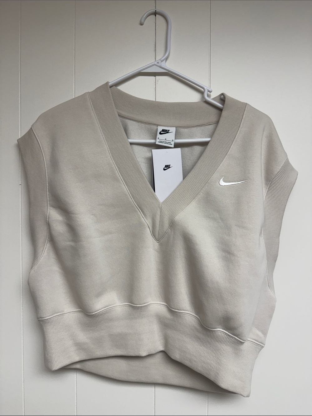 Nike V‑Neck Sleeveless Sweatshirt Vest in Light Beige with White Swoosh